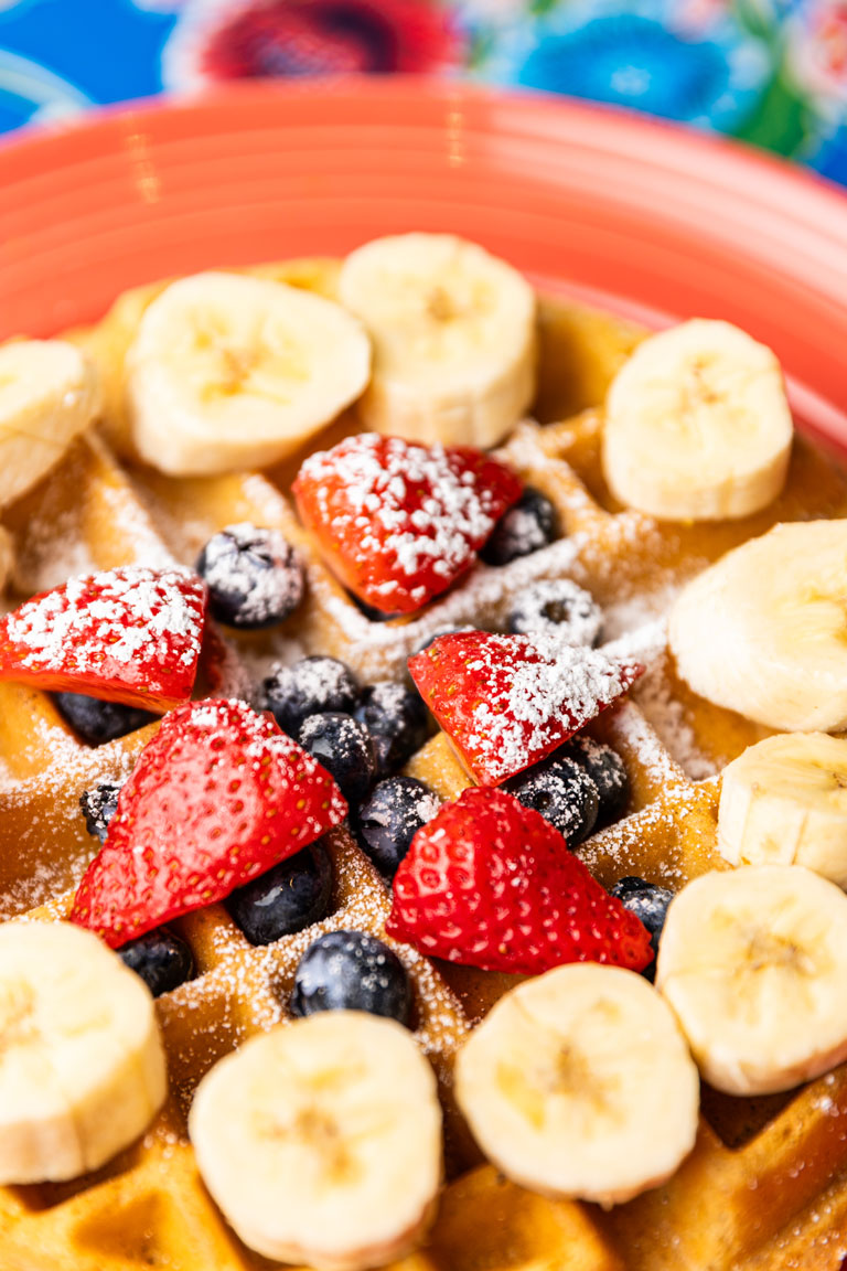 Waffle Topped with Banana, Strawberries and Blueberries