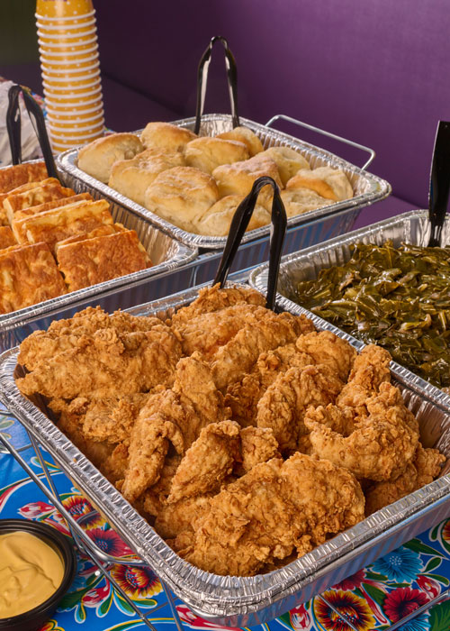 Buffet of Chicken, Biscuits and Greens in catering tins